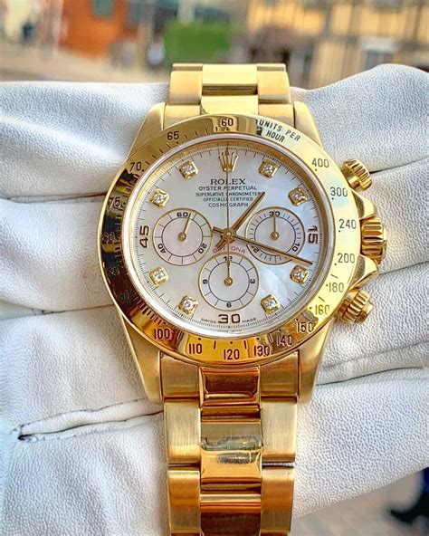 rolex yellow gold watch.